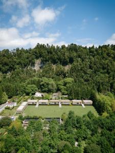 an aerial view of a park in the middle of a forest at Furnas Lake Forest Living in Furnas