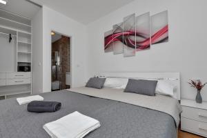 Posteľ alebo postele v izbe v ubytovaní Apartment Silver