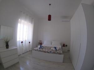 Posteľ alebo postele v izbe v ubytovaní Oudeis Holidays Apartments Tropea