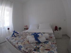 Posteľ alebo postele v izbe v ubytovaní Oudeis Holidays Apartments Tropea