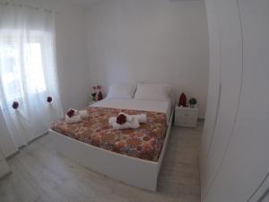 Posteľ alebo postele v izbe v ubytovaní Oudeis Holidays Apartments Tropea