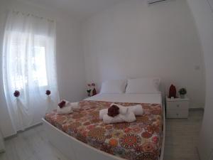 Posteľ alebo postele v izbe v ubytovaní Oudeis Holidays Apartments Tropea