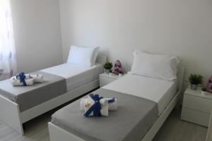 Posteľ alebo postele v izbe v ubytovaní Oudeis Holidays Apartments Tropea