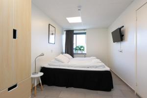 Voodi või voodid majutusasutuse Kalmar Hotell toas