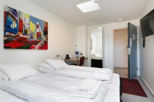 Voodi või voodid majutusasutuse Kalmar Hotell toas