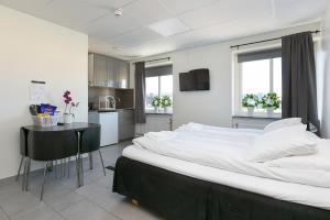 Voodi või voodid majutusasutuse Kalmar Hotell toas