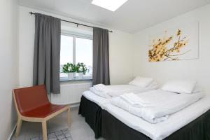 Voodi või voodid majutusasutuse Kalmar Hotell toas