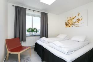 Postel nebo postele na pokoji v ubytování Kalmar Hotell