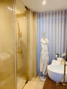 a bathroom with a shower and a sink and a toilet at Quinta Do Bosque in Mesão Frio