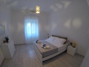 Posteľ alebo postele v izbe v ubytovaní Oudeis Holidays Apartments Tropea