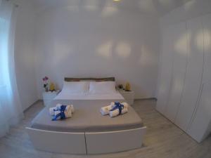 Posteľ alebo postele v izbe v ubytovaní Oudeis Holidays Apartments Tropea