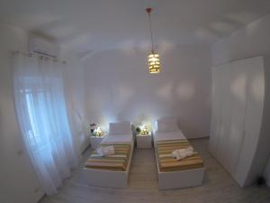 Posteľ alebo postele v izbe v ubytovaní Oudeis Holidays Apartments Tropea
