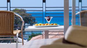 a fruit stand with fruit on a sunny day at Spetses Hotel in Spetses