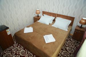 Ένα ή περισσότερα κρεβάτια σε δωμάτιο στο Xum Don