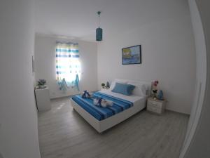Posteľ alebo postele v izbe v ubytovaní Oudeis Holidays Apartments Tropea