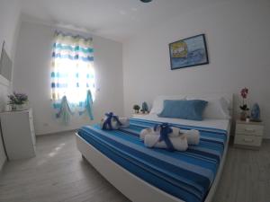 Posteľ alebo postele v izbe v ubytovaní Oudeis Holidays Apartments Tropea