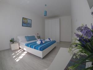 Posteľ alebo postele v izbe v ubytovaní Oudeis Holidays Apartments Tropea