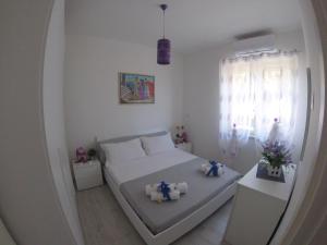 Posteľ alebo postele v izbe v ubytovaní Oudeis Holidays Apartments Tropea