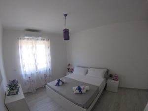 Posteľ alebo postele v izbe v ubytovaní Oudeis Holidays Apartments Tropea