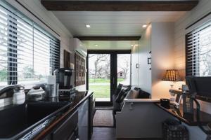 a kitchen with a sink and a counter top at Tiny CargoHome near Magnolia Silos Baylor in Waco