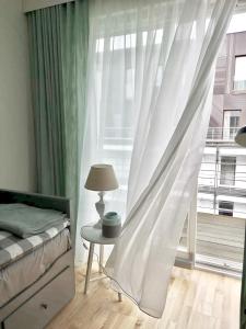 Łóżko lub łóżka w pokoju w obiekcie Blue Sea Apartment