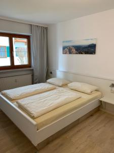 Ένα ή περισσότερα κρεβάτια σε δωμάτιο στο Ferienwohnung Karrasch