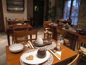 a dining room with wooden tables and chairs at Hotel La Fontana in Trieste