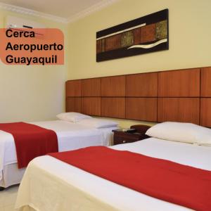 Voodi või voodid majutusasutuse Hotel Murali - Cerca del Aeropuerto de Guayaquil toas