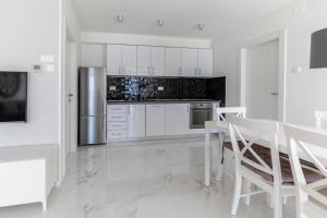 Kuchyňa alebo kuchynka v ubytovaní The View Residence + 6 fotografií