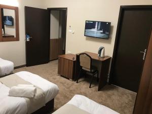 TV a/nebo společenská místnost v ubytování Eli Guest House