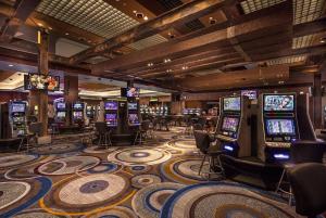 a casino with a bunch of slot machines at Bally's Vicksburg in Vicksburg