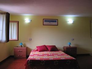 A bed or beds in a room at B&B Monte Gruttas