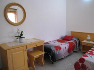 A bed or beds in a room at B&B Monte Gruttas