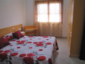 A bed or beds in a room at B&B Monte Gruttas