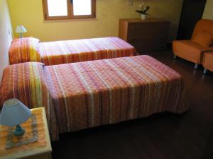 A bed or beds in a room at B&B Monte Gruttas