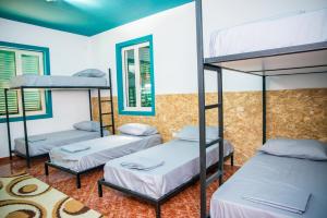 Rúm í herbergi á Our Way Guest House & Hostel