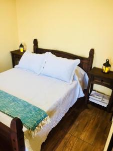 Кровать или кровати в номере Hospedaje “ El Segoviano “