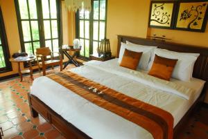 Postel nebo postele na pokoji v ubytování Baan Chai Thung Resort + 37 fotografií