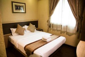 Postel nebo postele na pokoji v ubytování Hotel Valenza