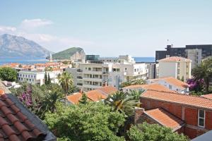 a view of a city with buildings and the ocean at The Old Town Terrace Apartments in Budva