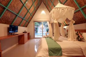 Postel nebo postele na pokoji v ubytování Makarma Resort Lombok