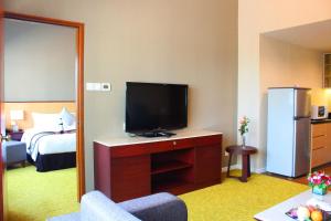 Uma televisão e/ou sistema de entretenimento em Summit Parkview Yangon
