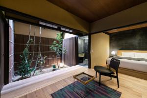 Llit o llits en una habitació de Nazuna Kyoto Gosho