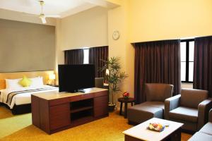 Uma televisão e/ou sistema de entretenimento em Summit Parkview Yangon
