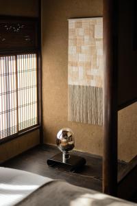 Llit o llits en una habitació de Nazuna Kyoto Gosho