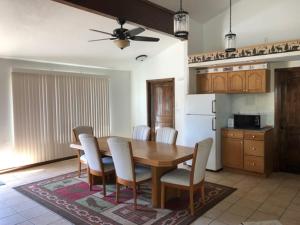 a kitchen with a dining room table and chairs at Alaska Home Rental in Soldotna