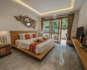 เตียงในห้องที่ La-Meli Villas Ubud