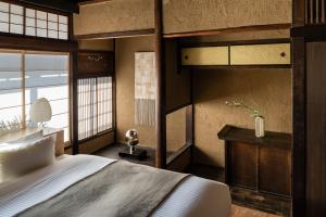 Llit o llits en una habitació de Nazuna Kyoto Gosho