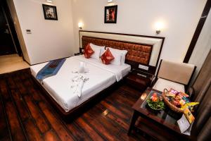 Ein Bett oder Betten in einem Zimmer der Unterkunft Comfort Inn Benares