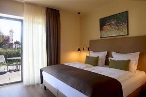 Postel nebo postele na pokoji v ubytování Farmer Hotel Basedow